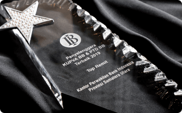 A 2019 award from Bank Indonesia in the form of a crystal trophy with a silver star on top.